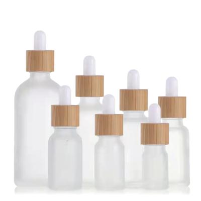 China Essential Oil Dropper Bottle 5ml 30ml 100ml Cosmetic Frosted Glass Eye Dropper Bottles Eye Dropper Bottle With Bamboo Lids for sale