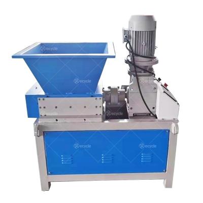 China Fabric,Metal,Plastics,Tires,Paper,Woods,Bucket,Boards Shredding Mini Double Shaft Shredder Machine for sale