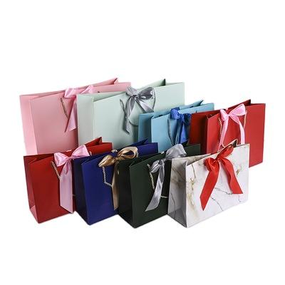 China Recyclable High Quality Luxury Bow Tie Cardboard Paper Colorful Shopping Tote Bag For Fashion Store for sale