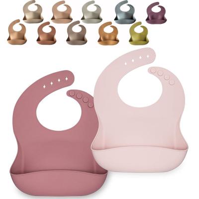 China Botão de fechamento Bebê de silicone bib logotipo personalizado Bebê Bibs de alimentação à venda