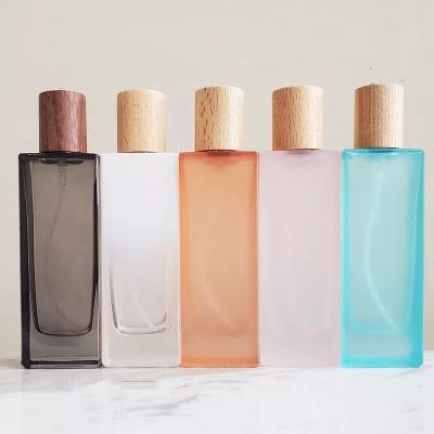 China For Kids And Adult Wholesale Spray Colors 50ml Glass Neck Knock Down Perfume Bottle With Wooden Cap for sale