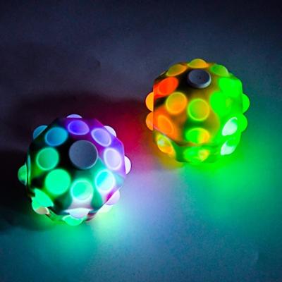 China 8cm fidgety person toys led stress balls autism sensory relaxation spinner cheap silicone ball light up fidgety person balls spinner for sale