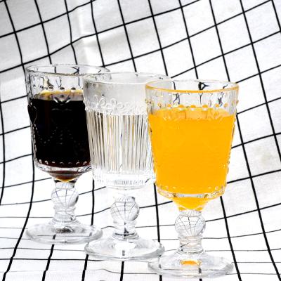 China Stocked Etched Pressed Pattern Designs Glass Cups With Foot High Quality Clear Wine Glass Stemware With Classic Shape for sale