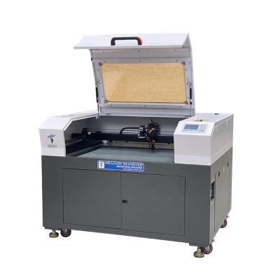 China UCO 6090 80w 100w Hotels Laser Cutting Machine with CCD Camera for Fabric Cloth Label Cutting for sale