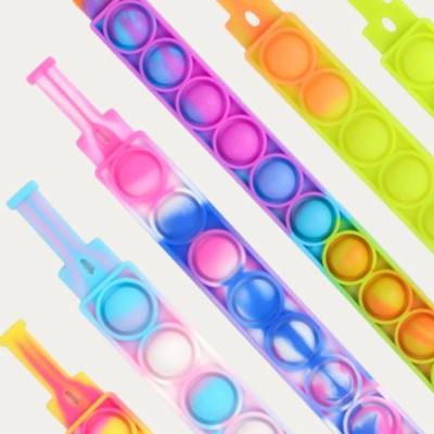 China Soft Washable Noise Bubble Push Up Wristband Squeeze Press Finger Relaxer Silicone Sensory Toy for Kids for sale