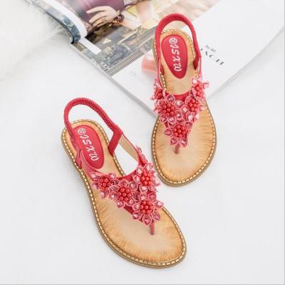 China 2019 Summer New Anti-slippery Bohemian handmade flower around the main toe sandals women shape trend wild sandals for sale