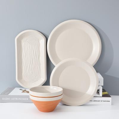 China Viable Custom Logo Irregular Shape Porcelain Luxury Black Dinner Sets Plates Matte Stoneware Tableware Sets Ceramic Dinnerware for sale