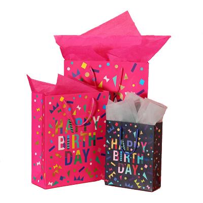 China Recyclable Wholesale Patterns Color Paper Board Bag Customizable Birthday Gift Bag With Handle for sale