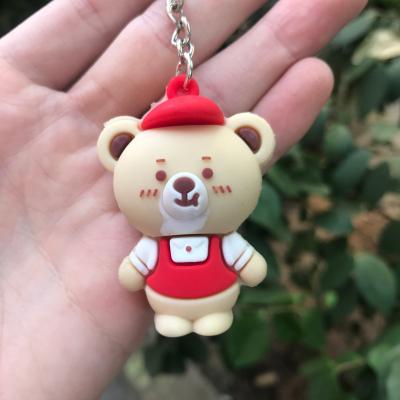 China Soft plastic three-dimensional cute bear bag doll key chain cartoon style PVC bear car pendant keychain for sale