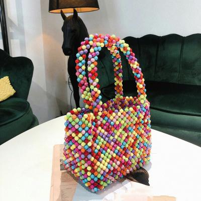 China Fashion 2020 spring and new Korean summer holiday dinner bead bag handmade beaded acrylic color woven bag handbag for sale