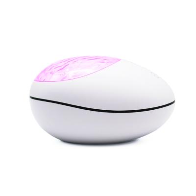 China Modern Lucky Stone Ocean Wave Projector Night Light Led Tooth Remote Control Blue Music for sale