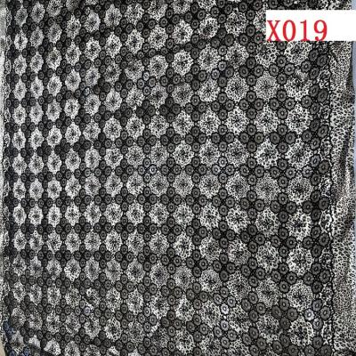 China 2022 new design sheer haydrotropic embroidery on print polyester spandex knitting fabric for dress for sale