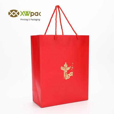 China Luxury Red Gift Paper Bag Custom Made Printed Logo  Packaging Shopping Paper Bag With Handles for sale