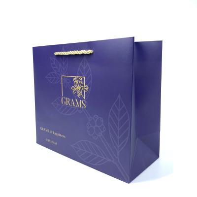 China Recycled custom cardboard luxury paper gift bags with handle for shopping with your own logo for sale