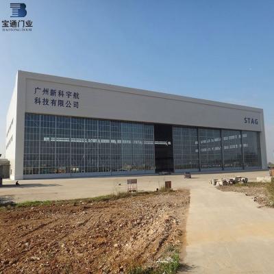 China Modern Customized Automatic Side Revolving Sliding Aircraft Hangar Door From China for sale