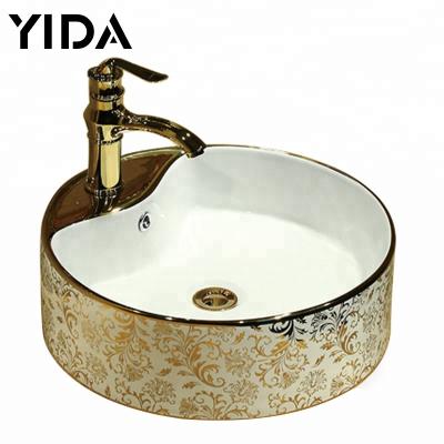 China Sustainable Sanitary Type Cabinet Sink Flower Gold Ceramic Ware Countertop Wash Basin for sale