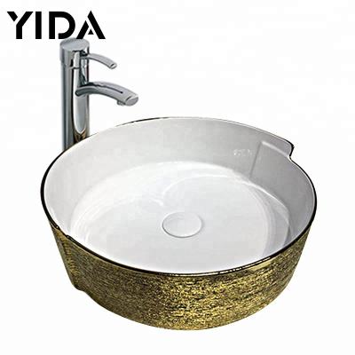 China Viable New Design Hotel Bathroom Fixtures Ceramic Gold Plated Color Chaozhou Bathroom Fixtures Vanity Top Wash Art Build Basin For for sale