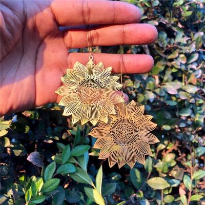 China 2022 CLASSIC fashion earring trend style women jewelry bohemian gold hollowed-out sunflower earrings dangling earrings for sale