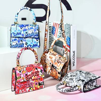 China Fashion Kid Purses PU Leather Cross and Mini Bags 2021 Cute Handbags Purses - Body Graffiti Girls Purses for sale