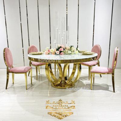 China (Others) wedding maker adjustable glass top round stainless steel wedding dining tables for sale