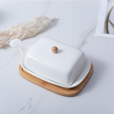 China Rectangular White Ceramic Bamboo Cover Stocked Butter Dish Tray Ceramic Dish Butter Keeper With Handle for sale