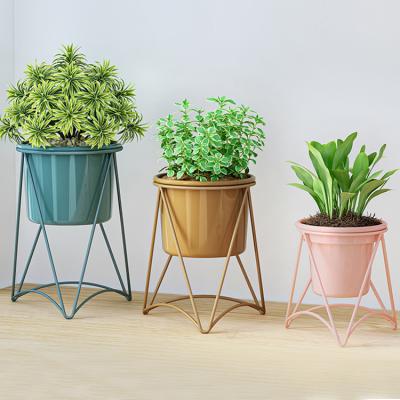 China Metal Gold Viable Flower Stand Wedding Centerpieces Indoor Tripod Flower Pot Floor Stand for sale