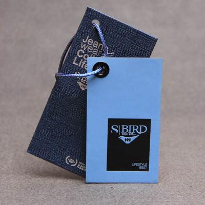 China Customized embossed sustainable kraft label /jeans string /paper hanger tag for sale