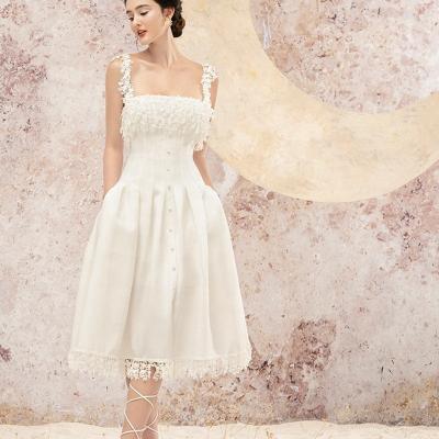 China Anti-static stain 2022 summer new dress white lace fringed cross straps backless design mid length dress for sale