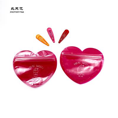 China Moisture Proof Resealable Love Shaped Packaging Bag With Self Adhesive Zipper Bag For Cookie Chocolate Snacks Candy for sale