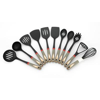 China 2022 Sustainable New Design Gold Painted Nylon Kitchen Utensils Set Heat Resistant Home And Kitchen Cooking Tool for sale