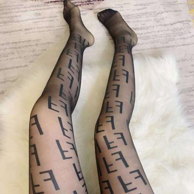 China Ladies B Letter Stockings G Net Stockings Transparent Pantyhose Fashion Basting Net Black White Flocking Stockings for sale