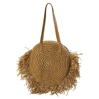 China Fashion Round Shoulder Straw Bag Bohemian Simple Hand Made Straw Woven Summer Beach Bag Tassels for sale