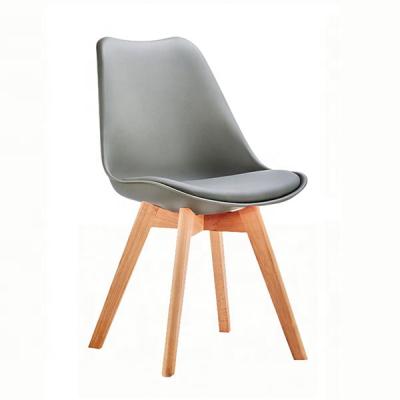 China Cheap Nordic Single Plastic PU Leather Tulip Dining Chair With Wooden Legs For Sale for sale