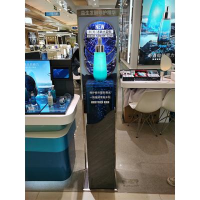 China The latest large light metal bottle display on cylinder decoration for makeup store for sale