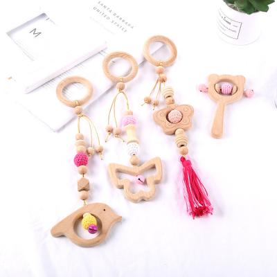 China Baby Chewable Toys 4 Pcs/Set Baby Teething Nursing Rattle Toys Gifts Toys Hanging Pendants Ring Teether Molar Wooden Gym Frame Stroller for sale