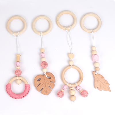 China Baby Chewable Toys 4 Pcs/Set Baby Teething Nursing Rattle Toys Gifts Toys Hanging Pendants Ring Teether Molar Wooden Gym Frame Stroller for sale