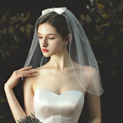 China New Simple Pencil Edge F7356 Fashion Big Bow Bridal Veil for sale