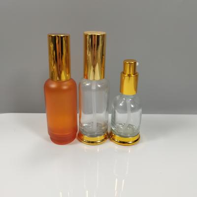 China Transparent 30ml Cosmetic Glass Custom Design Glass Eye Dropper Bottle With Gold Flower Basket Cap for sale