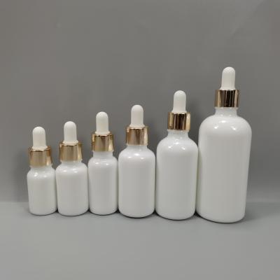 China LOGO Pearl Cosmetic Custom Printing White Glass Essential Oil Dropper Bottle With Child Proof Bamboo Lid for sale