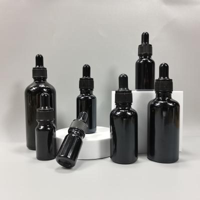 China Cosmetic Glass Bottle Glass Bottles Violet Dark Glass Oil Bottles for sale