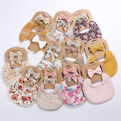 China Handsome Handsome Printed Double Sided Canvas Cotton Baby Bibs Set With Bows Headband for sale