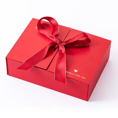 China Biodegradable Magnetic Filp Top Double Door Fold Door Perfume Skin Care Mystery Gift Open Paper Box Packaging With Ribbon Tied In A Bow for sale