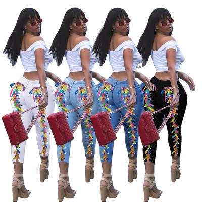 China 2021 drop shipping ladies denim crossover viable jeans pants colorful custom lace pencil jeans pants for women for sale