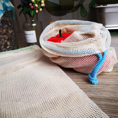 China Custom Eco Friendly Biodegradable Cotton Vegetable And Fruit Handled Mesh Beach Bags for sale