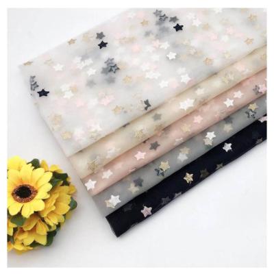 China Viable 3D cartoon star pattern embroidered 100% polyester lace fabric YiwuTextiles cheap for kids skirt for sale