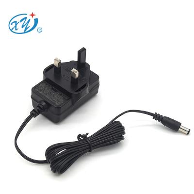 China PC Plug CE GS TUV certificate12V 1A Flame Retardant UK AC DC Adapter Power Supply for sale