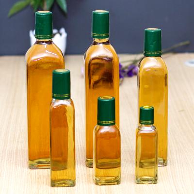 China Viable 250ml 500ml 750ml Olive Oil Bottle Green Transparent Empty Amber Glass Olive Oil Bottles With Lid for sale