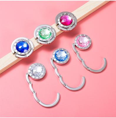 China Bag Accessories Bag Hanger Bling Hook Purse Hot Selling Zinc Alloy Hanger for Table Ganchos Para ropa for sale