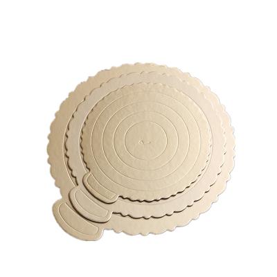 China Disposable Round Shape Wavy Gold Cardboard Cake Circles for sale