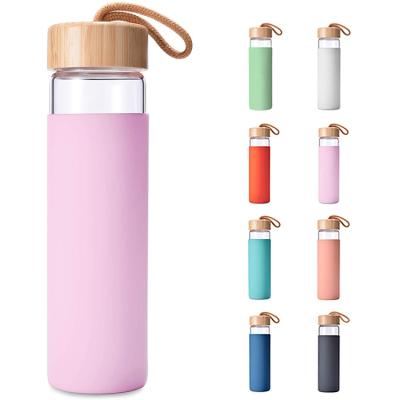 China Viable Promotional Custom Logo High Quality Borosilicate Double Wall Insulated Glass Bottle Water With Bamboo Lids for sale